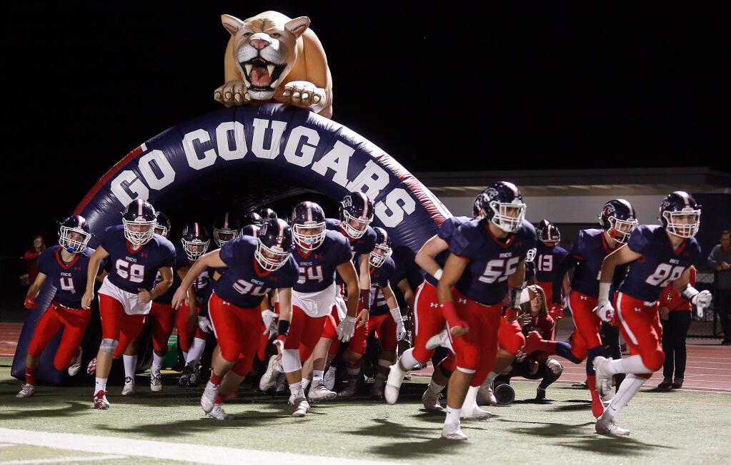 The Rancho Cotate Cougars take the field during the NCS Division 2 varsity football playoff game between Casa Grande and Rancho Cotate high schools in Rohnert Park on Friday, Nov. 2, 2018. (Alvin Jornada / The Press Democrat)