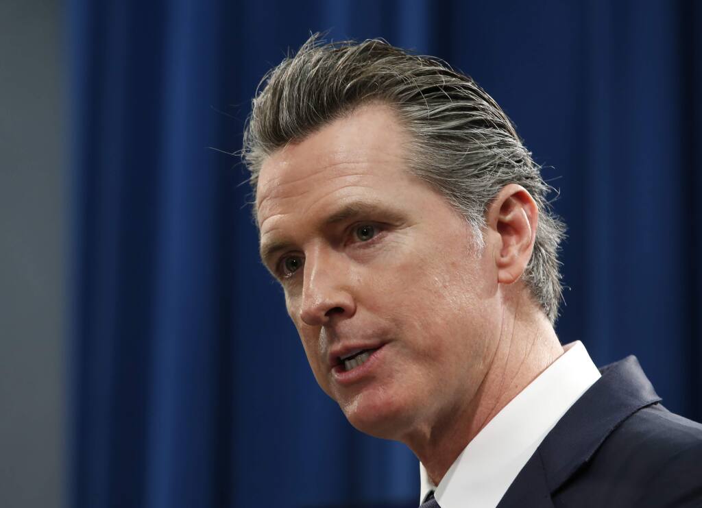 FILE - In this Jan. 10, 2020 file photo California Gov. Gavin Newsom responds to a reporters question during a news conference in Sacramento, Calif. Newsom's proposal to sharply reduce the time a convict is under supervised release could wind up sending more criminals to jail or prison according to a report by the nonpartisan legislative analyst released Tuesday, Feb. 18, 2020. (AP Photo/Rich Pedroncelli, File)