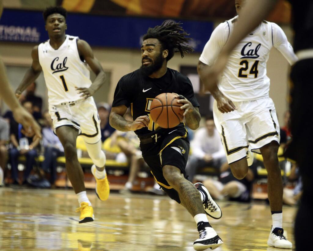 Virginia Commonwealth guard Jonathan Williams (10) dribbles through the Cal defense during the second half of aTuesday, Nov. 21 game in Lahaina, Hawaii. (AP Photo/Marco Garcia)