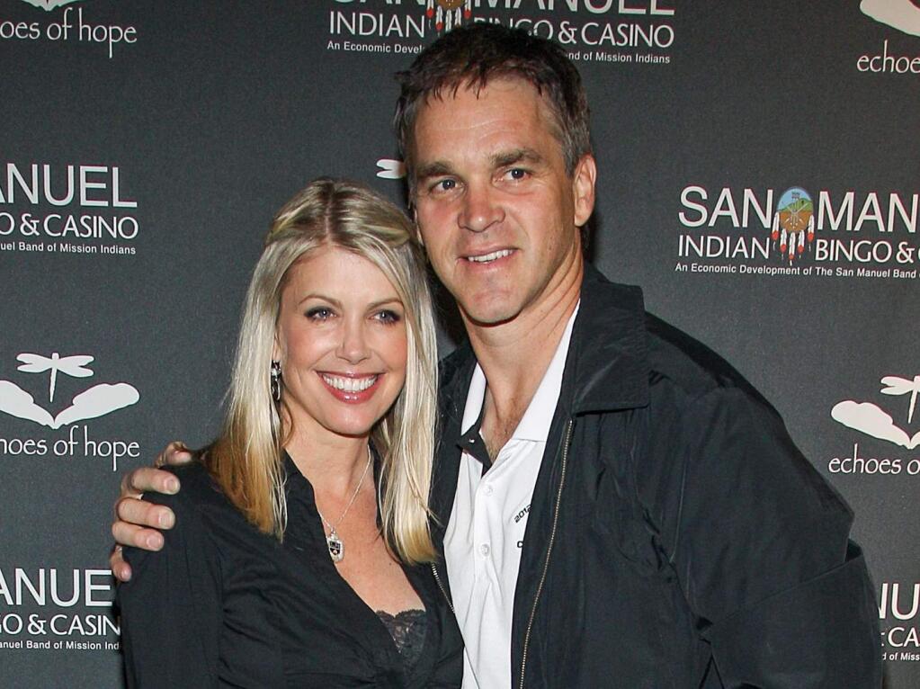 FILE - In this June 23, 2013, file photo, former NHL Player Luc Robitaille and his wife Stacia Robitaille attend Echoes Of Hope's 3rd Annual Luc Robitaille Celebrity Charity Poker Tournament in Los Angeles. The wife of Hall of Fame hockey player Luc Robitaille has tweeted about an encounter with Donald Trump more than two decades ago in an elevator at Madison Square Garden. (Photo by Paul A. Hebert/Invision/AP, File)