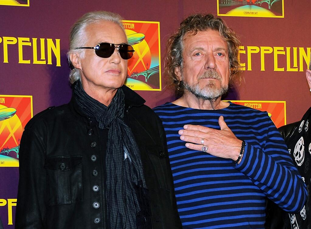 FILE - In this Oct. 9, 2012 file photo, Led Zeppelin guitarist Jimmy Page, left, and singer Robert Plant appear at a press conference ahead of the worldwide theatrical release of 'Celebration Day,' a concert film of their 2007 London O2 arena reunion show, in New York. Led Zeppelin's lawyers asked a judge Monday, June 20, 2016, to throw out a case accusing the band's songwriters of ripping off a riff for 'Stairway to Heaven.' (Photo by Evan Agostini/Invision/AP, File)