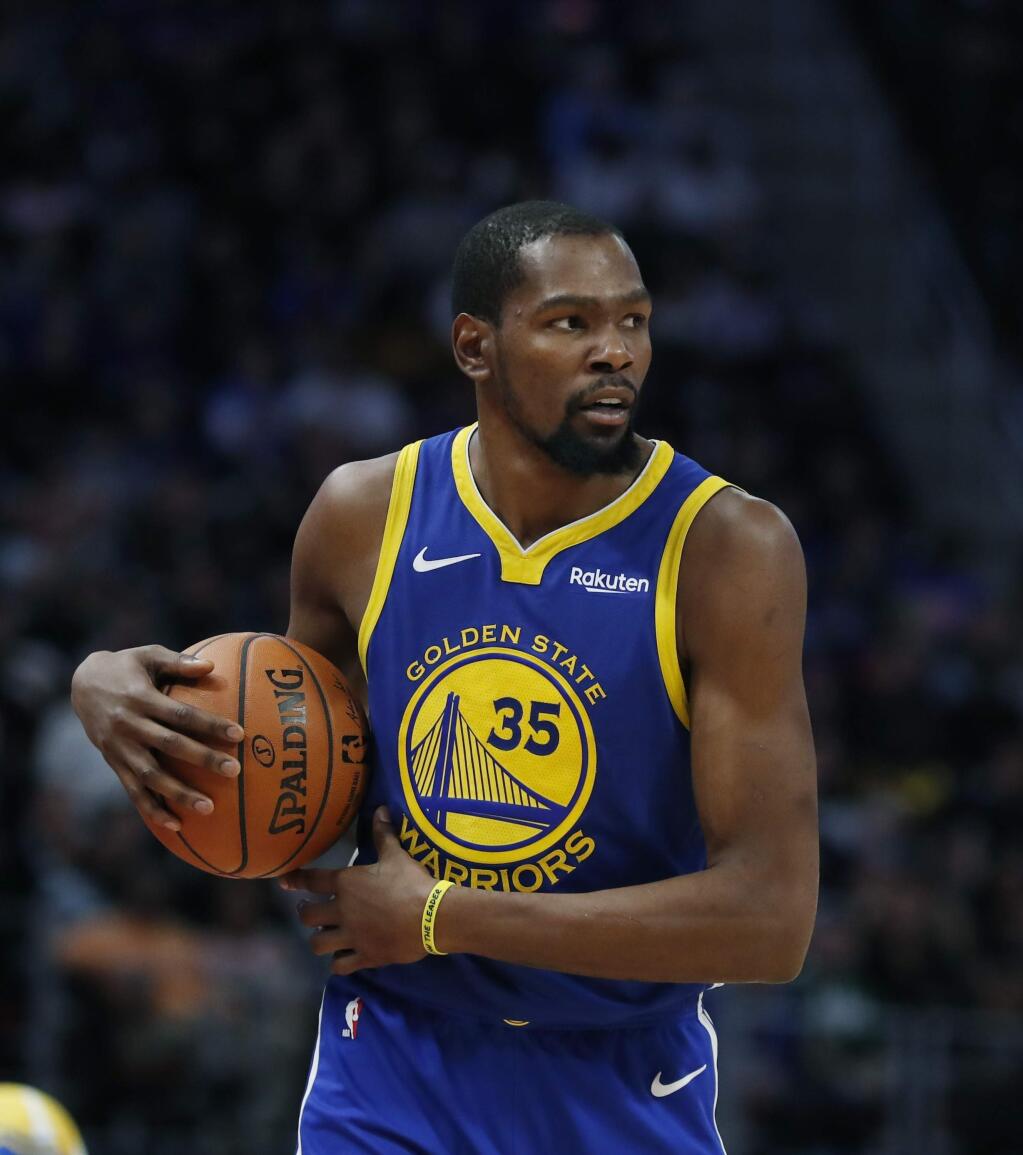 Golden State Warriors forward Kevin Durant brings the ball up court during the second half against the Detroit Pistons, Saturday, Dec. 1, 2018, in Detroit. (AP Photo/Carlos Osorio)