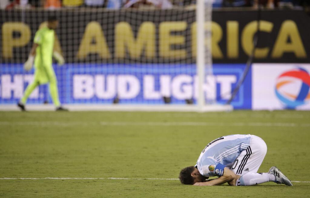 Argentina's Lionel Messi reacts after losing 4-2 to Chile in penalty kicks during the Copa America Centenario championship soccer match, Sunday, June 26, 2016, in East Rutherford, N.J. (AP Photo/Julio Cortez)
