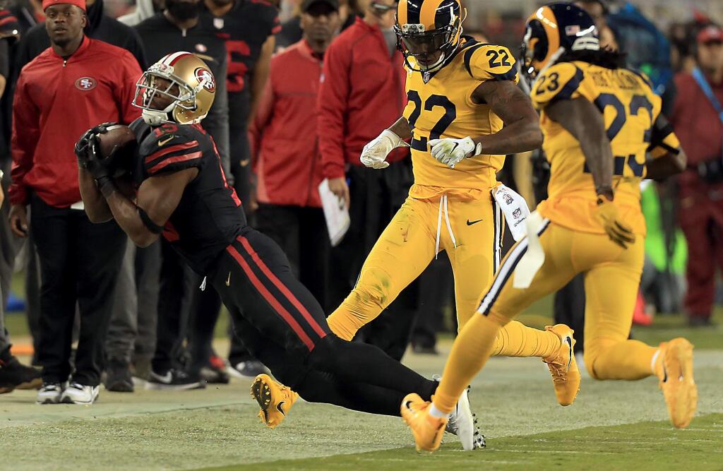 Pierre Garcon makes a tip-toe catch past Ram defenders Trumaine Johnson (22) and Nickell Robey-Coleman Thursday Sept. 21, 2017 at Levi's Stadium in Santa Clara. (Kent Porter / The Press Democrat)