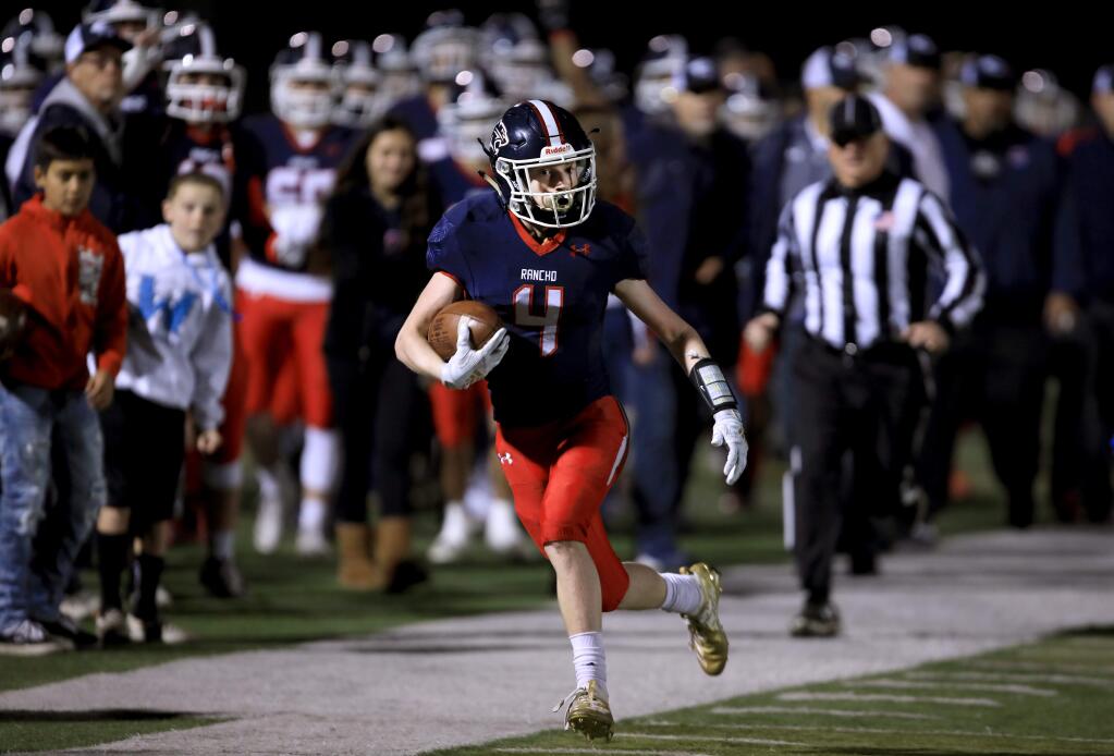 Gianni Gigliello of Rancho Cotate sprints down the sidelines only to have the ball called back due to a holding penalty during the Cougars' NCS playoff game against Benicia, Saturday, Nov. 23, 2019. (Kent Porter / The Press Democrat) 2019