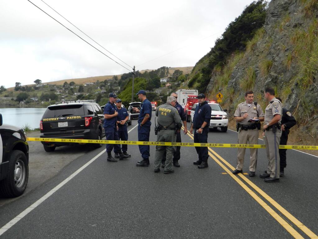 Sonoma County Sheriff's deputies and other first responders at the scene of a fatal crash Tuesday morning. A Jenner woman lost control of her pickup on Highway 1 and plunged into the Russian River. Her daughters, ages 6 and 4, drowned. Photo taken near Jenner, Tuesday, Aug. 23, 2016. (COURTESY OF PAT PATERSON)