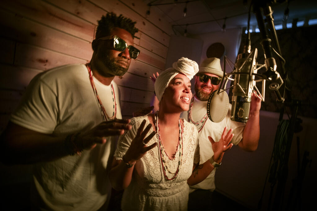 R&B artist Simoné Mosely records her song “Yellow Flowers” with collaborators Reggie Stephens, left, and Jason Williams at Gaugr Studios in Santa Rosa on Monday, Nov. 1, 2021. The song, off the album “Forward Back,” is a tribute to the Nigerian Yoruba deity Oshun. (John Burgess/The Press Democrat)