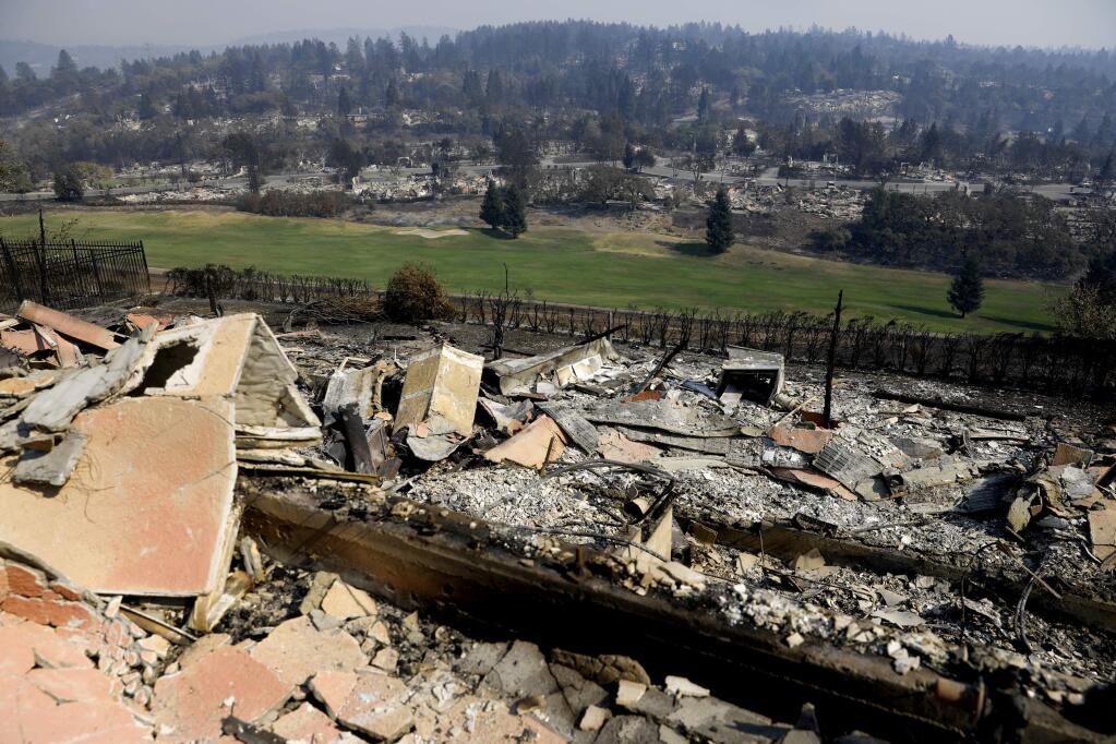The rubble of homes burned surrounding the golf course in the Fountaingrove area of Santa Rosa, on Sunday, Oct. 15, 2017. (BETH SCHLANKER/ The Press Democrat)