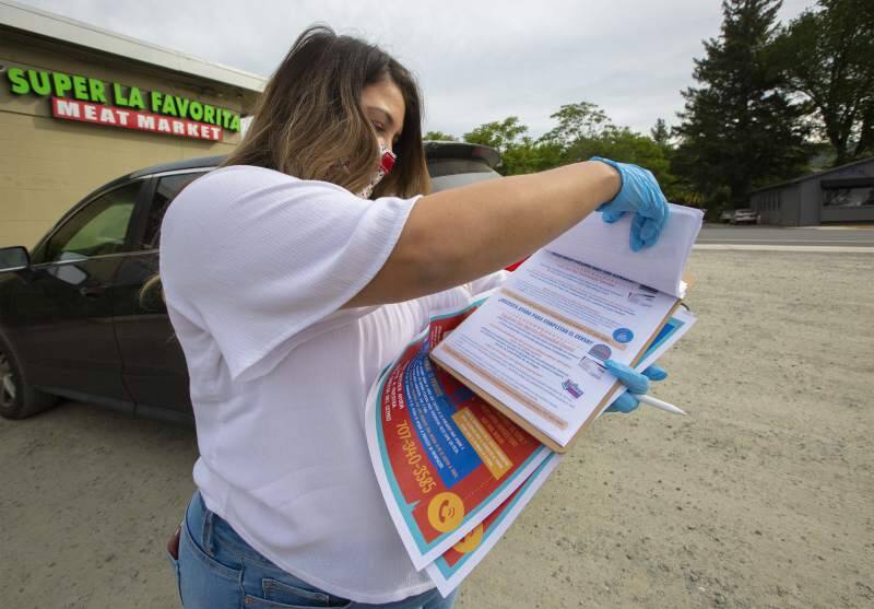 Angie Lopez, from the La Luz Center, carries plenty of information to hand out to anyone who needs help filling out the 2020 Census forms. (Photo by Robbi Pengelly/Index-Tribune).