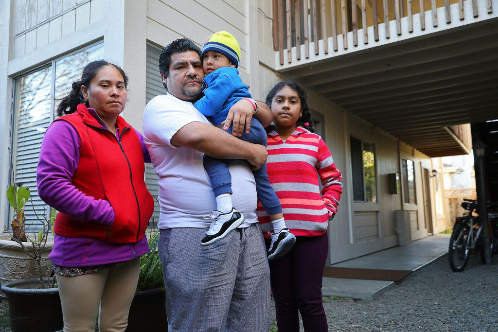 Francisco Arguelles, with his wife Silvia Diaz, and children, Francisco Arguelles Diaz, 3, and America Arguelles Diaz, 10, are being evicted from their apartment on Piper Street due to new ownership plans to renovate the property. (Christopher Chung/ The Press Democrat)