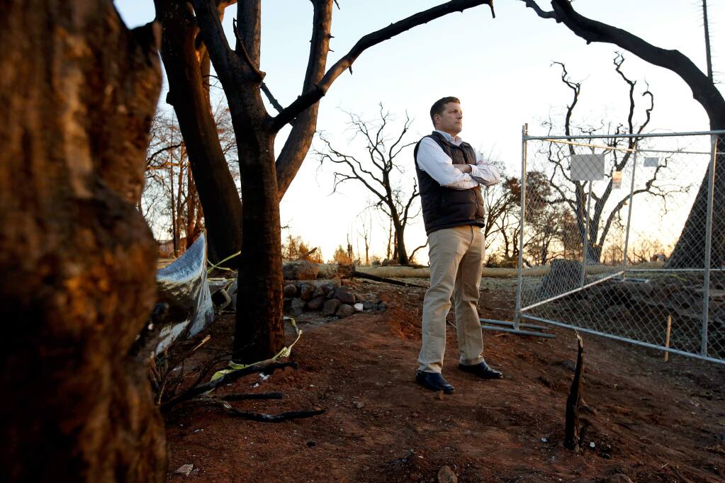 Robert Bivin poses for a portrait where his home stood on Stony Oak Court before it was destroyed in the Tubbs Fire, in the Fountaingrove neighborhood of Santa Rosa, California on Thursday, December 21, 2017. Bivin is one of 10 USAA insurance customers who are suing the provider for its deficient coverage and claim work in the aftermath of the October wildfires. (Alvin Jornada / The Press Democrat)