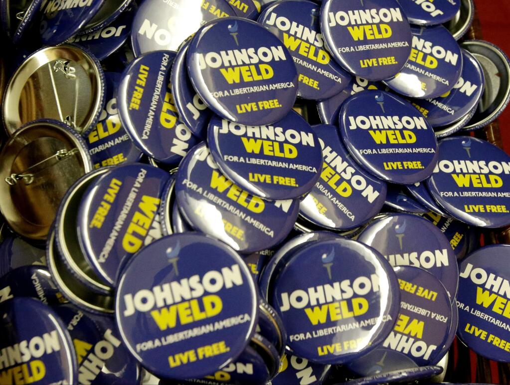 Campaign buttons for Gary Johnson and Bill Weld, the Libertarian presidential ticket in 2016. (JOHN RAOUX / Associated Press)