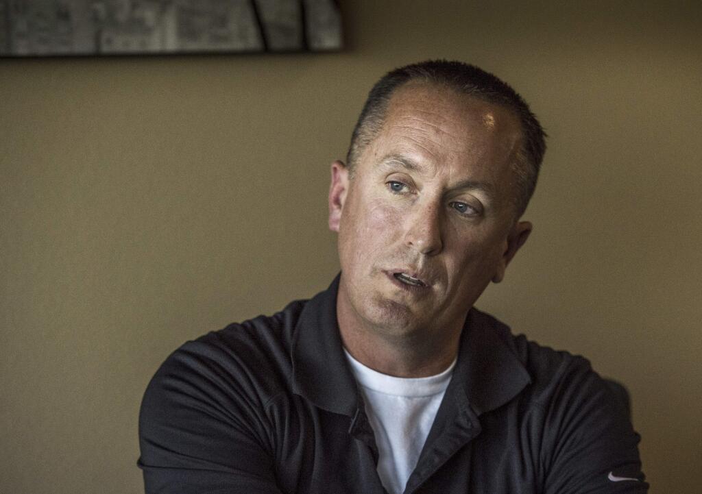 California Highway Patrol officer Chris Lutz talks at his attorney's office in Fresno on Wednesday, Oct. 25, 2017. He claims his managers in the CHP's Oakhurst office in Madera County have denied him time off for military assignments, harassed him with unfounded allegations and driven him to file a lawsuit against his employer. (Hector Amezcua/The Sacramento Bee via AP)