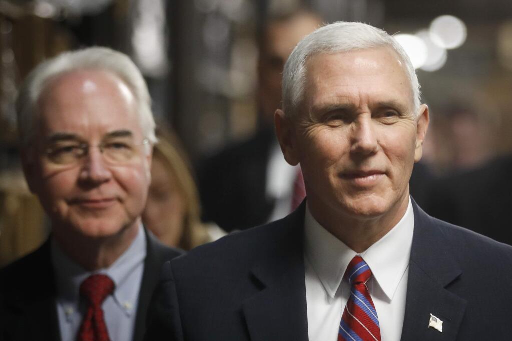 Vice President Mike Pence, accompanied by Health and Human Services Secretary Tom Price, left, tours the Frame USA facility, Thursday, March 2, 2017, in Springdale, Ohio. (AP Photo/John Minchillo)