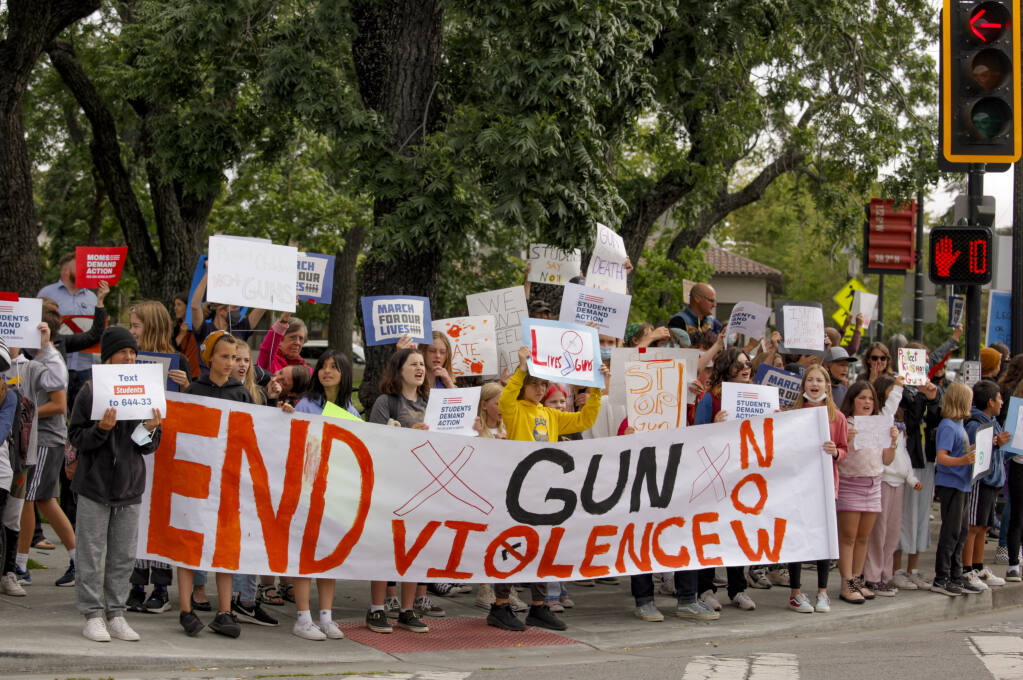 Students from McNear Elementary School march Thursday, May 26, 2022, from their school to Walnut Park in a demonstration calling for better gun control. (CRISSY PASCUAL / ARGUS-COURIER STAFF)