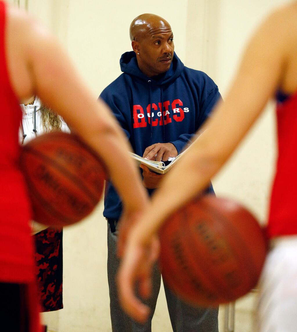 Rancho Cotate head coach Mario Newton talks to his team during girls varsity basketball practice at Rancho Cotate High School on Wednesday, December 14, 2016. (Alvin Jornada / The Press Democrat)
