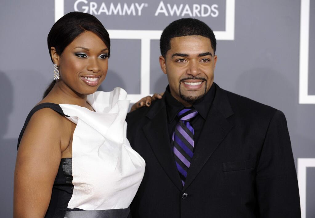 FILE - In this Feb. 8, 2009 file photo, Jennifer Hudson, left, and David Otunga arrive at the 51st Annual Grammy Awards in Los Angeles. Hudson has obtained an order of protection against Otunga. Police in suburban Chicago say Otunga was removed from the couple's home in Burr Ridge, Illinois, Thursday night after being notified of the order. (AP Photo/Chris Pizzello, File)