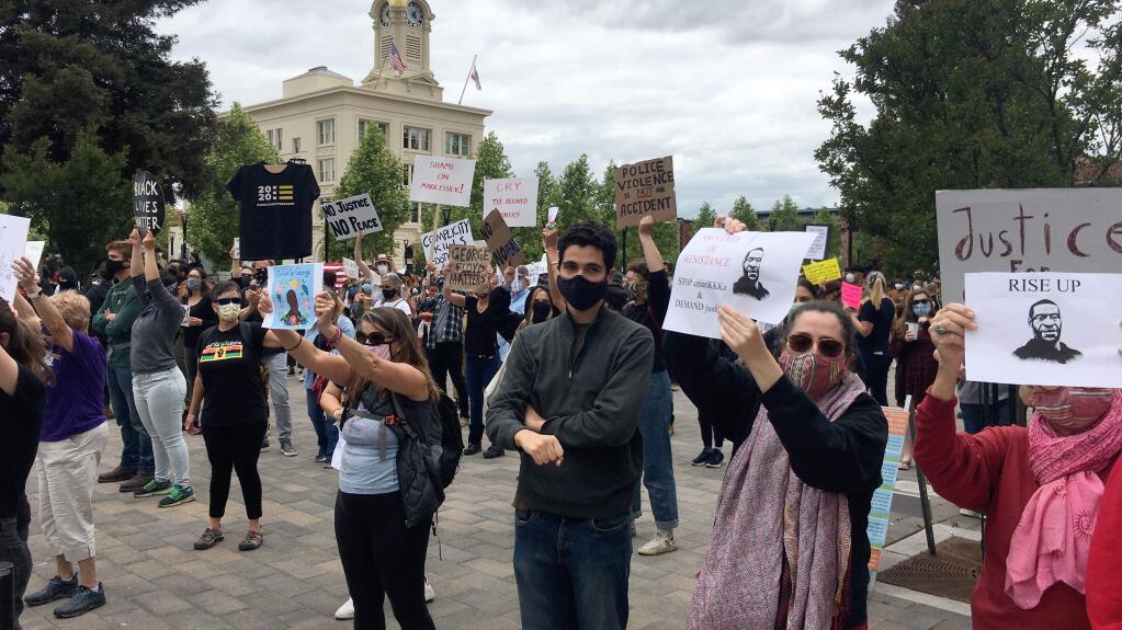 Hundreds gathered at Old Courthouse Square in Santa Rosa to protest the deaths of black men and women at the hands of law enforcement on Saturday, May 30, 2020. (Kent Porter/The Press Democrat)