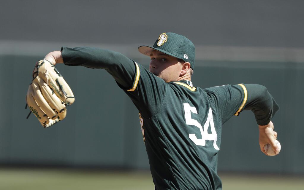 Oakland A's pitcher Sonny Gray throws during the first inning of a spring training game against the Arizona Diamondbacks, Tuesday, March 7, 2017, in Scottsdale, Ariz. (AP Photo/Darron Cummings)