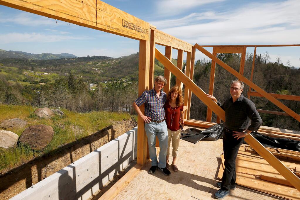Fire survivors Jeff Sengstack, left, and his wife, Birgit Meitza-Sengstack, and attorney Jon Eisenberg pose for a portrait at the Sengstacks' home, which is being rebuilt after it burned down during the Tubbs Fire, in the Larkfield-Wikiup neighborhood of Santa Rosa, California, on Friday, April 19, 2019. (Alvin Jornada / The Press Democrat)