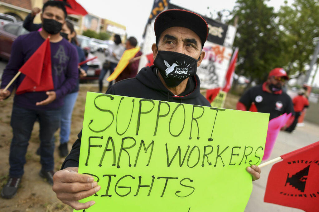 Farmworker Inocencio Cortez joins the rally in downtown Fresno on Cesar Chavez Day to help urge Gov. Gavin Newsom to sign the Ag Labor Voting Choice Act, providing more choices in how farm workers can vote in their union elections. March 31, 2022. Photo by John Walker/The Fresno Bee