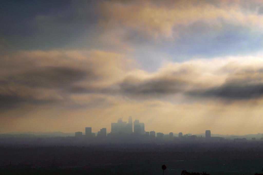 Downtown Los Angeles is shrouded in early morning coastal fog and smog. (AP Photo/Richard Vogel, File)