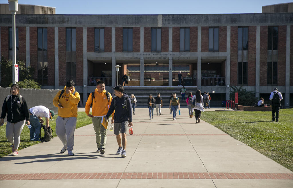 Students walk near Meiklejohn Hall at California State University East Bay on Feb. 25, 2020. Photo by Anne Wernikoff for CalMatters