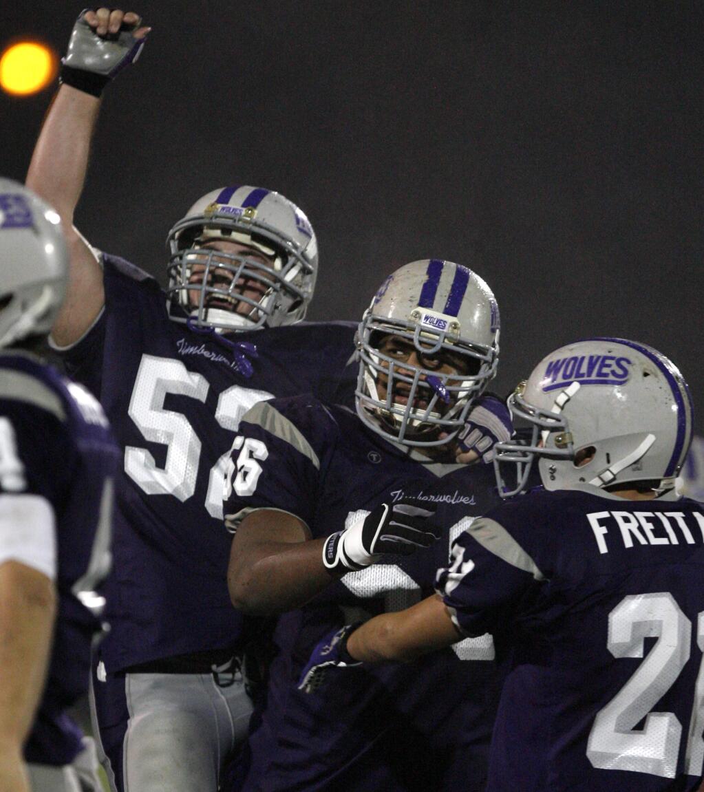 Fort Bragg players celebrate after winning the Division IV NCS championship game in 2009. (PD FILE)