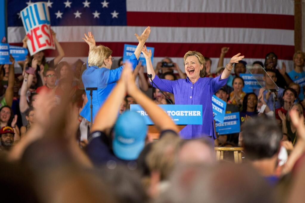 Democratic presidential candidate Hillary Clinton, is introduced by Sen. Elizabeth Warren, D-Mass., left, at a rally at at the Cincinnati Museum Center at Union Terminal in Cincinnati, Monday, June 27, 2016. (AP Photo/Andrew Harnik)