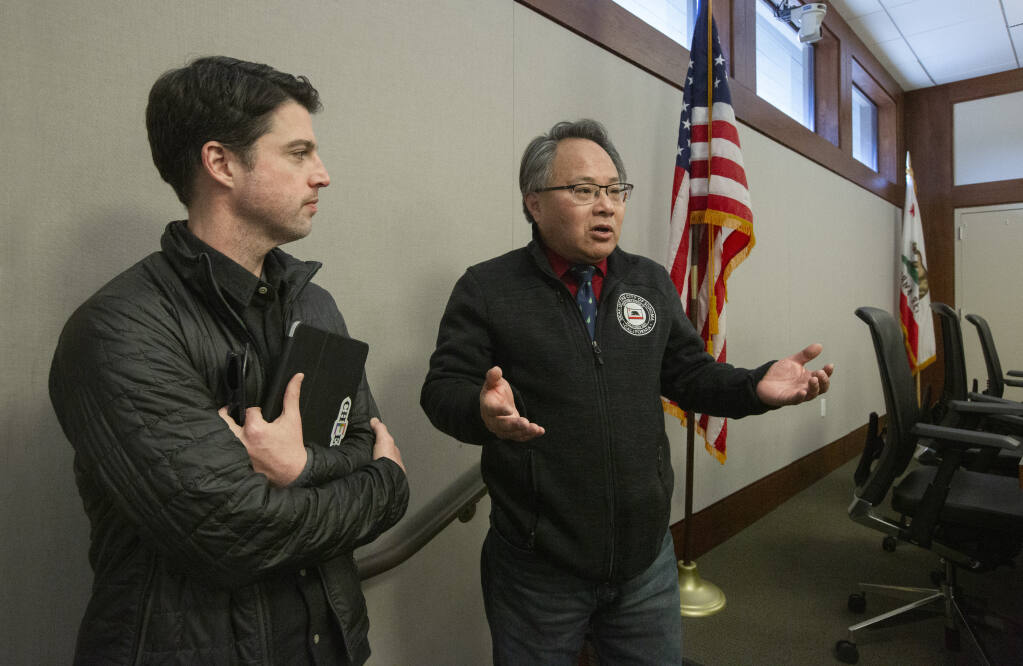 Mayor Jack Ding, right, and Vice Mayor Kelso Barnett following a special City Council meeting that took place in the Council Chambers on First Street West on Friday, Dec. 2, 2022. (Robbi Pengelly/Index-Tribune)