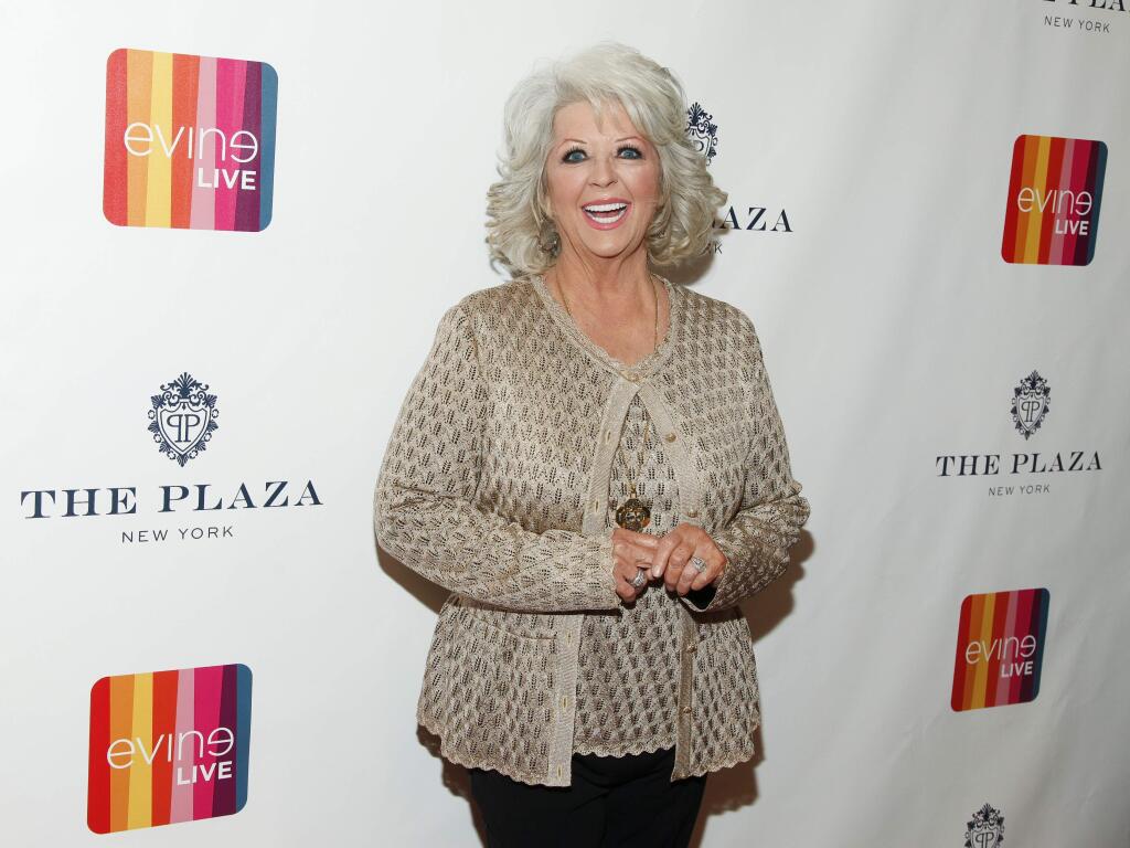 FILE - In this Feb. 13, 2015 file photo, Paula Deen attends the EVINE Live launch event at The Todd English Food Hall at The Plaza in New York. A spokesman for Deen says she didn't post a 2011 Halloween costume photo on her Twitter account showing her son Bobby in dark makeup as 'I Love Lucy' character Ricky Ricardo. Deen spokesman Jaret Keller said Tuesday, July 7, 2015, that a social media manager posted the photo taken in connection with Deen's former Food Network show. (Photo by Andy Kropa/Invision/AP, File)