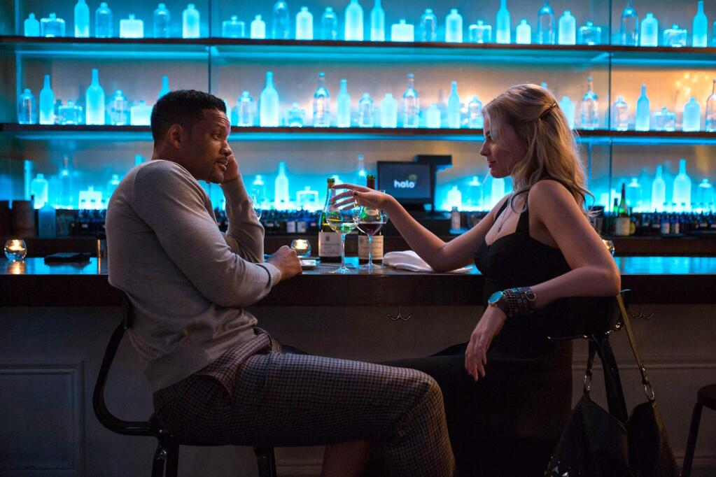 Will Smith stars as a con artist who takes on an apprentice, Margot Robbie, right, but years later finds himself competing with her in a planned scam. (WARNER BROS. PICTURES)