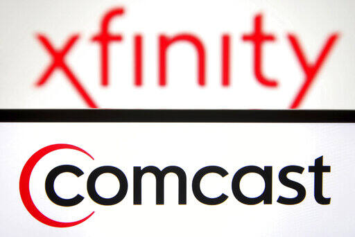 In this photo illustration a Comcast logo is seen on a smartphone screen with a Xfinity logo in the background. (Photo by Pavlo Gonchar / SOPA Images/Sipa USA)(Sipa via AP Images)