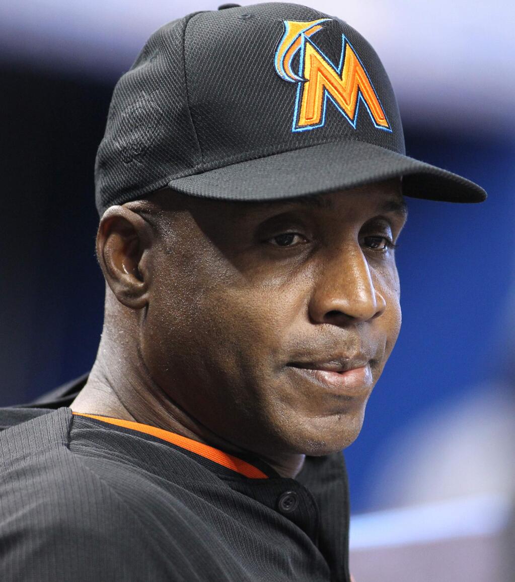 Miami Marlins hitting coach Barry Bonds listen to a member of the media before a baseball game against the Washington Nationals Wednesday, April 20, 2016, in Miami. (AP Photo/Luis M. Alvarez)