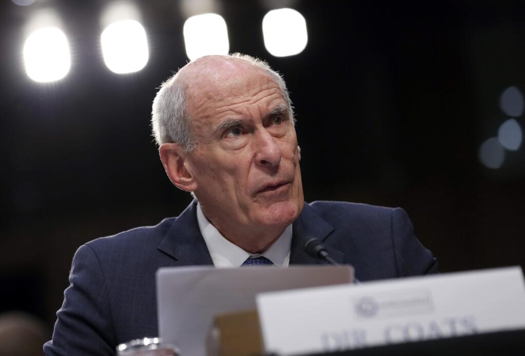 National Intelligence Director Dan Coats gives his statement during a Senate Intelligence Committee hearing about the Foreign Intelligence Surveillance Act, on Capitol Hill, Wednesday, June 7, 2017, in Washington. (AP Photo/Alex Brandon)