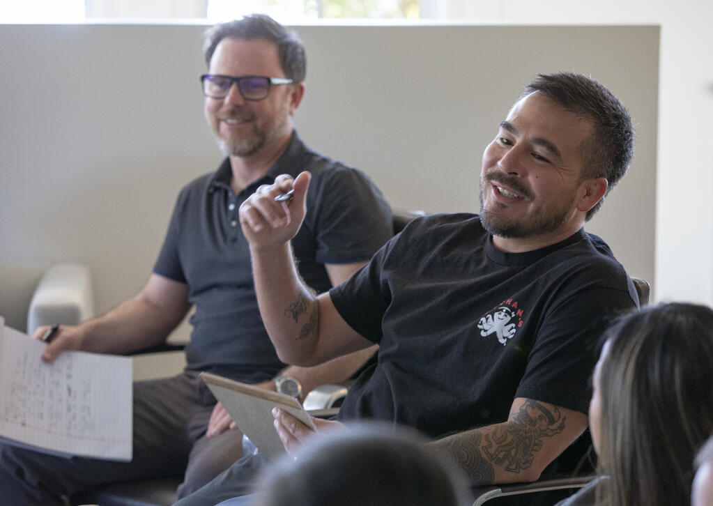 Justin Gill, founder and CEO of Bachan's Japanese Barbecue Sauce address his team in a staff meeting at their downtown Sebastopol headquarters on Wednesday April 6, 2022. T Gill’s left is Nate Morr, Chief Operating Officer(Chad Surmick / The Press Democrat)