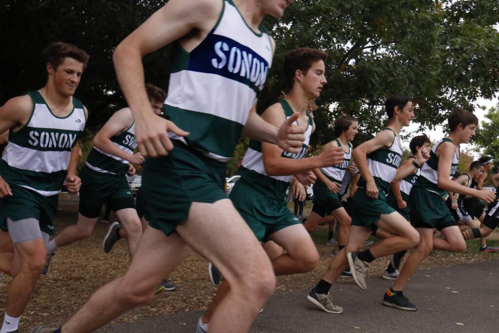The Sonoma Valley boys cross country team breaks from the starting line at Maxwell Farms Regional Park, doing a match with Windsor on Wednesday, Sept. 12. (Christian Kallen/Index-Tribune)