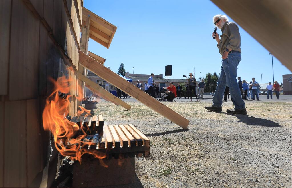 Press, fire officials and others gather, Tuesday, June 18, 2019 at the Santa Rosa Junior College Public Safety Training Center in Windsor as fire scientist Dr. Stephen Quarles demonstrates the flammability of different types of building materials. (Kent Porter / The Press Democrat) 2019