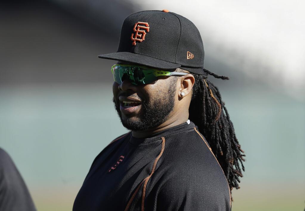 San Francisco Giants pitcher Johnny Cueto warms up before Game 3 of the National League Division Series against the Chicago Cubs in San Francisco, Monday, Oct. 10, 2016. (AP Photo/Ben Margot)