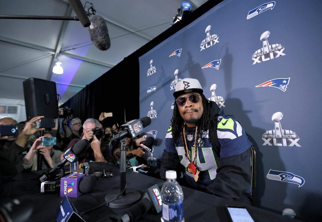 Seattle Seahawks' Marshawn Lynch attends a news conference for NFL Super Bowl XLIX football game, Wednesday, Jan. 28, 2015, in Phoenix. The Seahawks play the New England Patriots in Super Bowl XLIX on Sunday, Feb. 1, 2015. (AP Photo/Matt York)