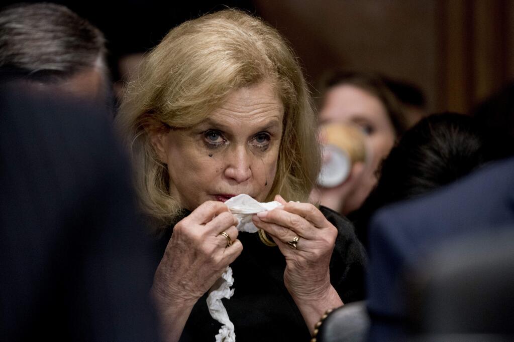 Rep. Carolyn Maloney, D-N.Y., becomes emotional while listening to Christine Blasey Ford testify before the Senate Judiciary Committee on Capitol Hill in Washington, Thursday, Sept. 27, 2018. (AP Photo/Andrew Harnik, Pool)