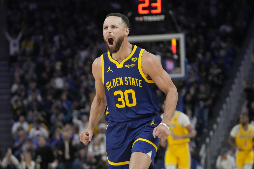 Golden State Warriors guard Stephen Curry reacts after making a 3-point basket against the Los Angeles Lakers during the first half in San Francisco, Thursday, Feb. 22, 2024. (Jeff Chiu / ASSOCIATED PRESS)