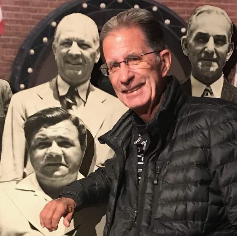 PHOTO FROM THE DARDIS FAMILYPete Dardis poses in front of a montage of baseball greats while visiting the Baseball Hall of Fame in Cooperstown, New York.