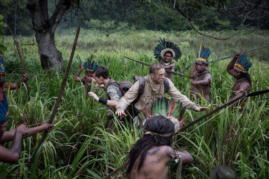Amazon Studios/Bleecker Street MediaCharlie Hunnam, right, as explorer Percy Hunnam, with Robert Pattinson as his aid find themselves surrounded by natives in the Amazon in 'The Lost City of Z.'