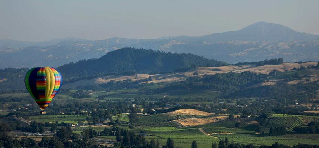 Geyser Peak and vineyards north of Windsor serve as a backdrop for the Sonoma County Hot Air Balloon Classic in Windsor in 2018. Sonoma County Tourism in a Feb. 24, 2021, virtual town hall laid out plans for the region’s recovery as coronavirus conditions improve and travel restrictions ease. (Kent Porter / The Press Democrat) 2018