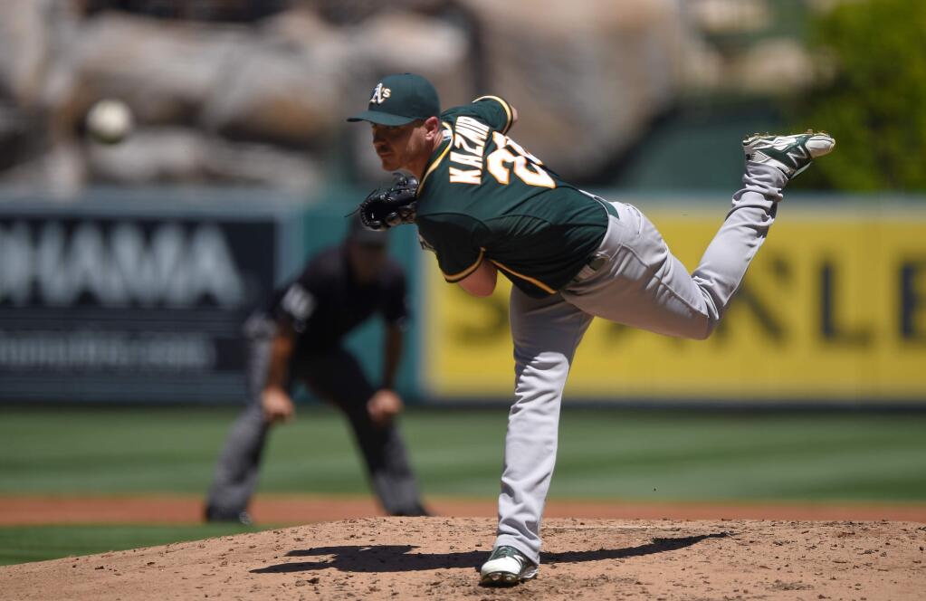 Oakland Athletics starting pitcher Scott Kazmir throws to the plate during the second inning of a baseball game against the Los Angeles Angels, Sunday, Aug. 31, 2014, in Anaheim, Calif. (AP Photo/Mark J. Terrill)