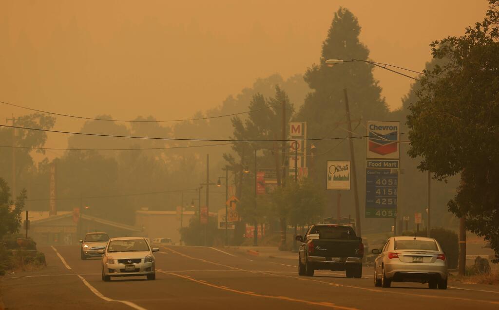 Downtown Laytonville is socked in with smoke along Highway 101, Friday Aug. 8, 2014 from the Lodge Fire. (Kent Porter / Press Democrat)