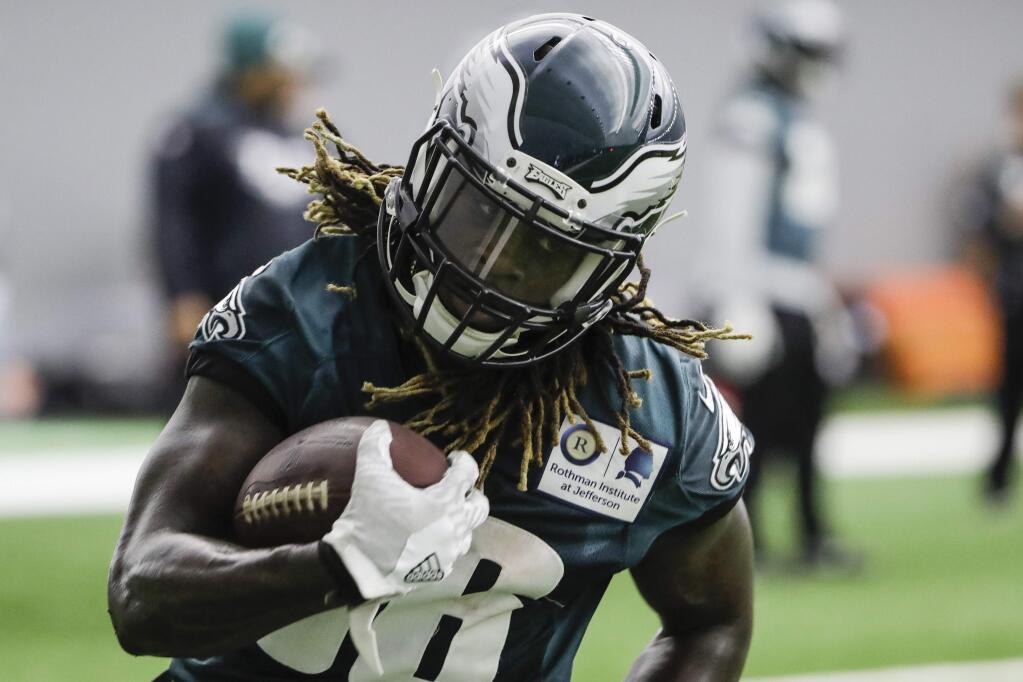 The Philadelphia Eagles' Jay Ajayi runs the ball during practice at the team's training facility in Philadelphia, Friday, Jan. 26, 2018. The Eagles face the New England Patriots in Super Bowl 52 on Sunday, Feb. 4, in Minneapolis. (AP Photo/Matt Rourke)