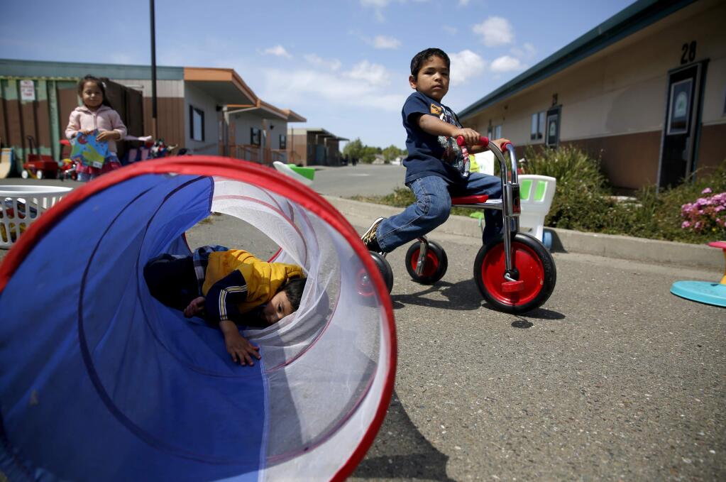 Esteban Estrada, 4, rides his tricycle at Via Esperanza on the Cook Middle School campus in Santa Rosa, on Wednesday, May 13, 2015. (BETH SCHLANKER/ The Press Democrat)