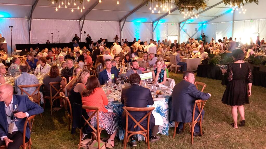 The Sonoma County Wine Auction drew several hundred people to La Crema Estate at Saralee's Vineyard in Richard's Grove outside Windsor on Saturday, Sept. 21, 2019. (Kent Porter / The Press Democrat)